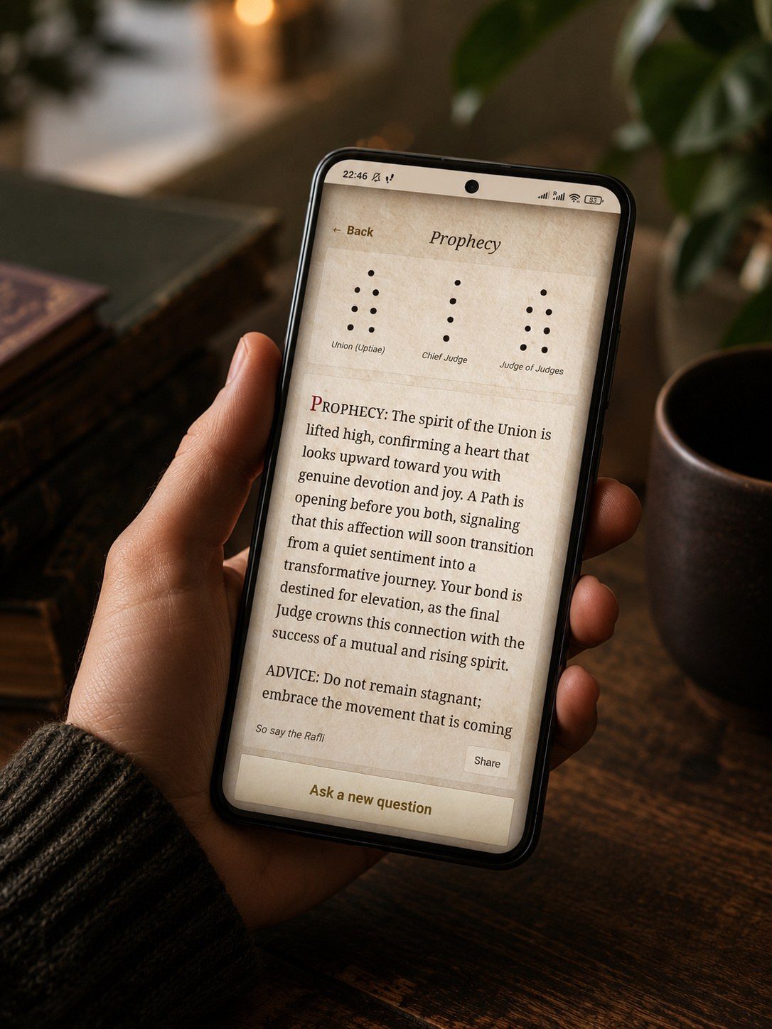 Rafli Divination app in hand